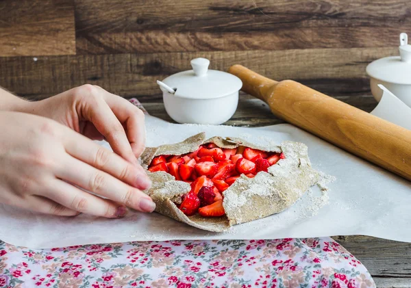 cooking processes biscuit with fresh strawberries, vegan dessert