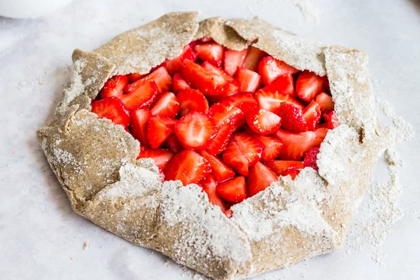 cooking processes biscuit with fresh strawberries, healthy desse