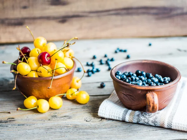 Fresh raw blueberry, yellow cherry and mulberry  on gray wooden — Stock Photo, Image