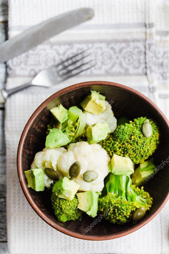 Winter vegetable salad with broccoli, cauliflower, avocados, pum