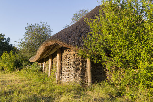 The old wooden houses, log cabins. Thatched roof.