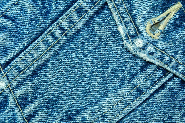 Blue denim fabric with seam — Stock Photo, Image