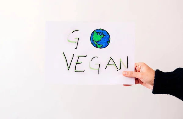 Hand Holds Poster Word Vegan White Background Vegan Concept — Stock Photo, Image