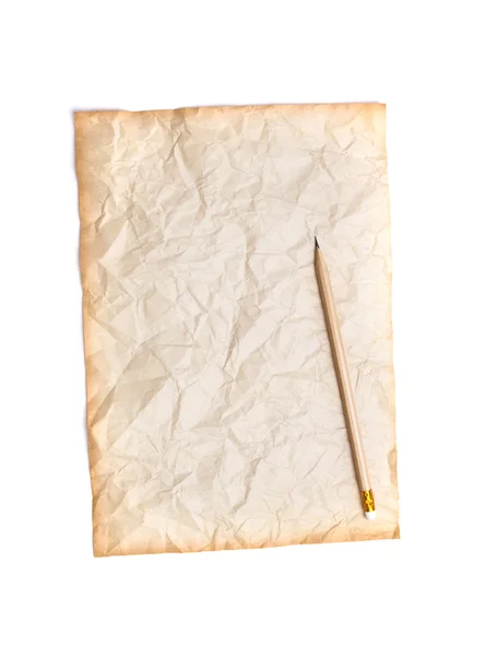 Деревянный карандаш на старой бумаге — стоковое фото