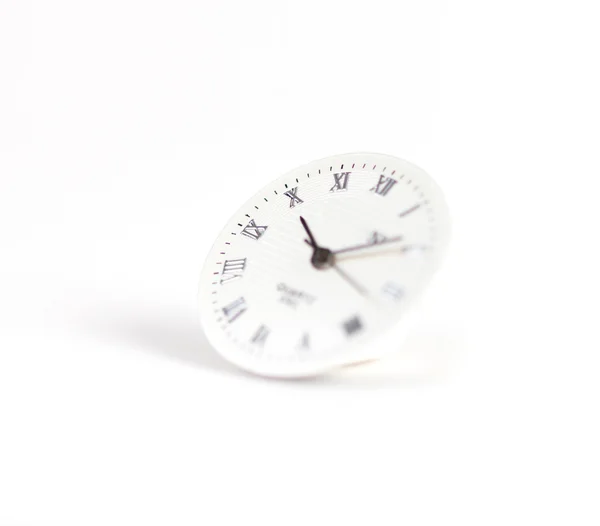 Selective focus on clock surface on white background — Stok fotoğraf