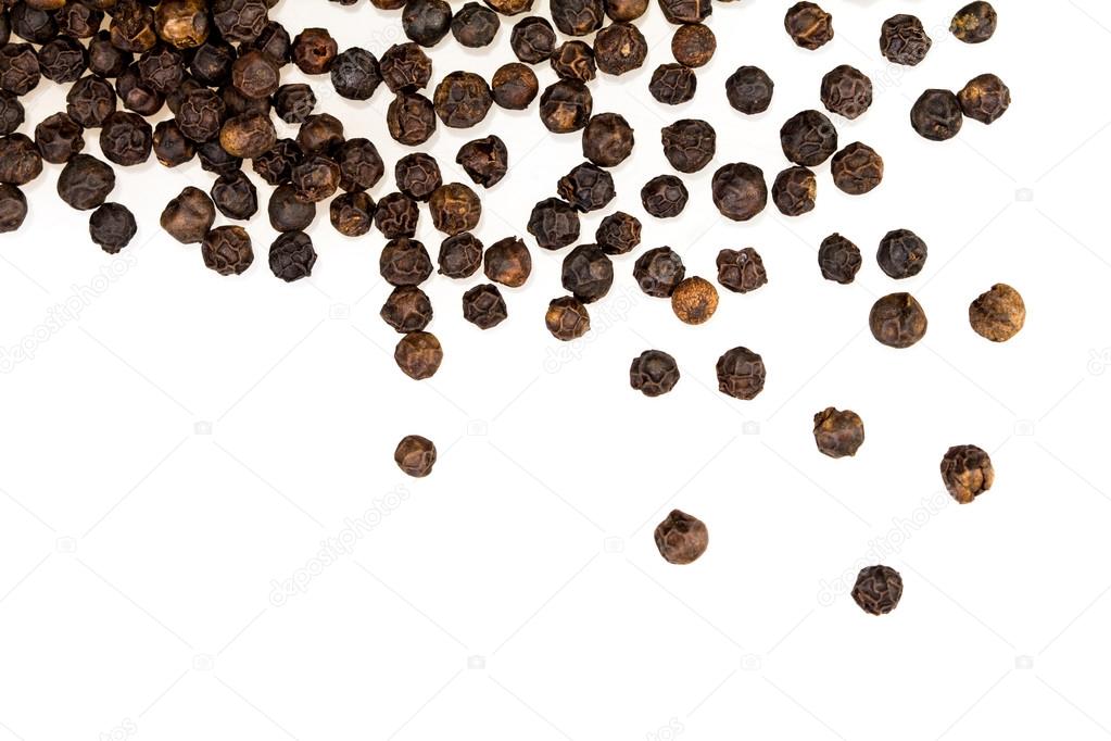 closeup dried black pepper on white background