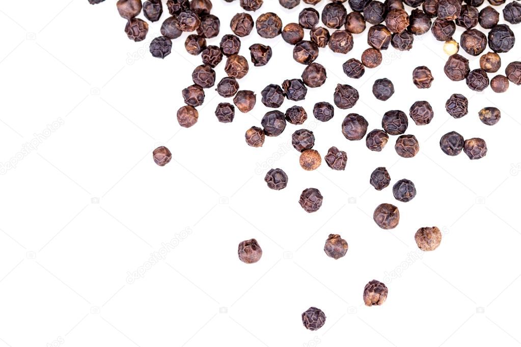 closeup dried black pepper on white background