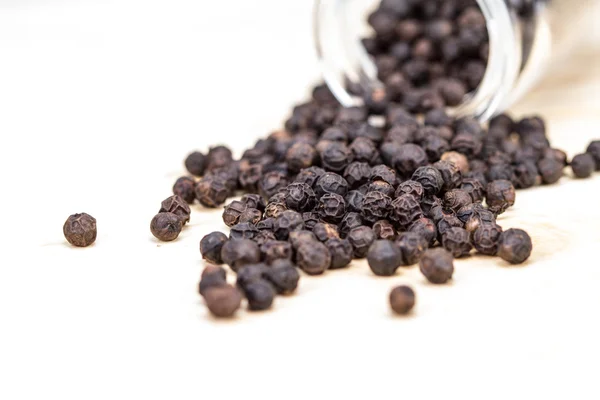 Closeup dried black pepper on white background , selective  focus Stock Image