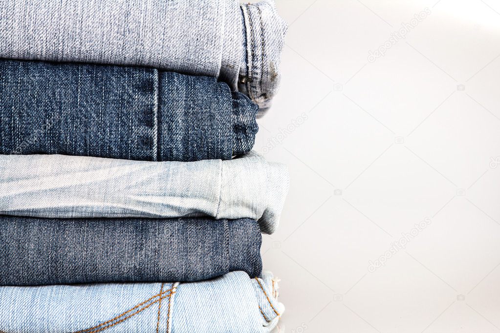 stacking of different blue jeans