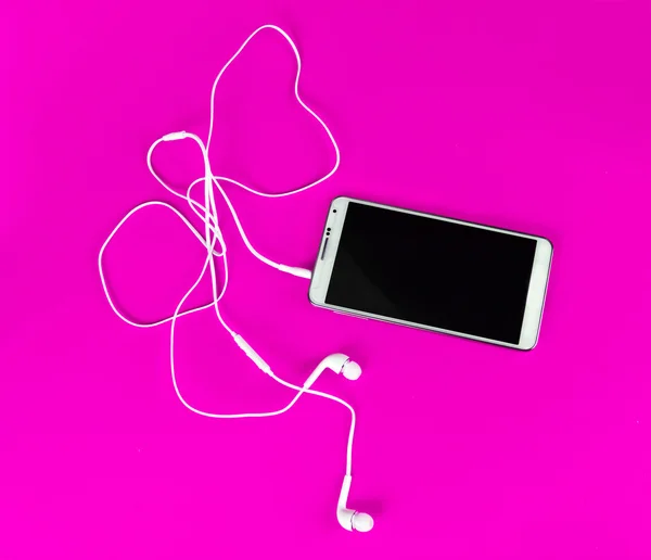 Bílá sluchátka pro použití s digitální hudbou nebo chytrý telefon — Stock fotografie