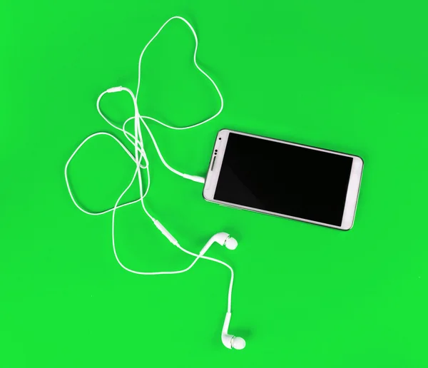 Fones de ouvido brancos para usar com música digital ou telefone inteligente — Fotografia de Stock