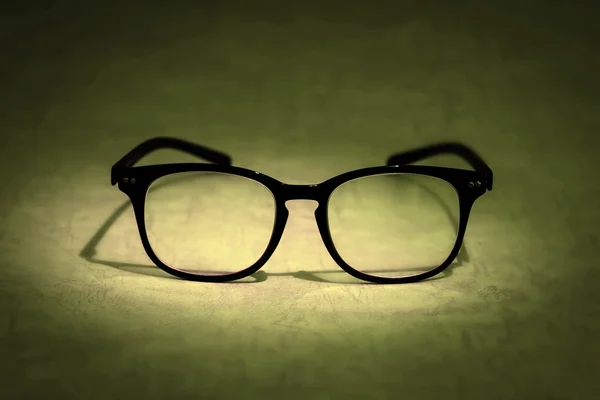 Still life with reading eyeglasses on blue background — Stock Photo, Image