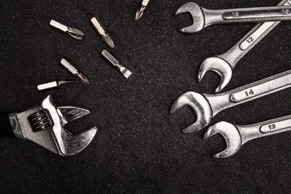 Set van roestvrij staal moersleutel op witte achtergrond met tekst Assa — Stockfoto