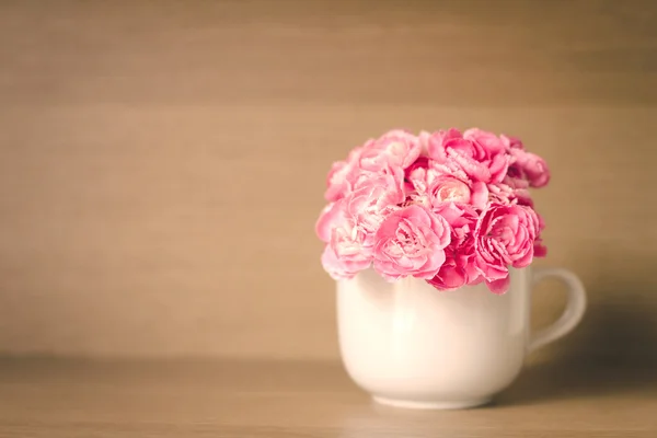 The Fresh pink carnation flower on wooden shelf background — Stock Photo, Image