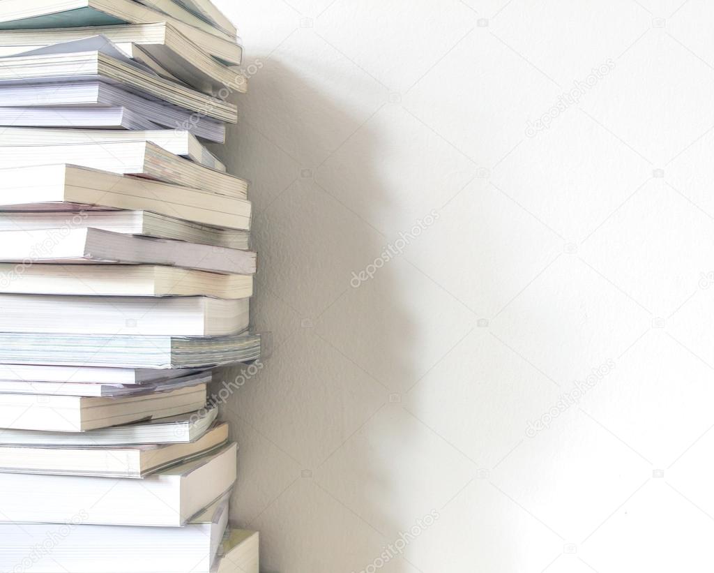 Close up book stacked  with concrete wall background