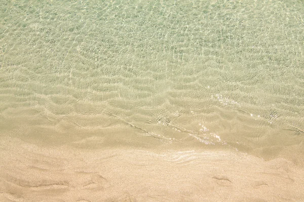 Пляжный песок и море — стоковое фото