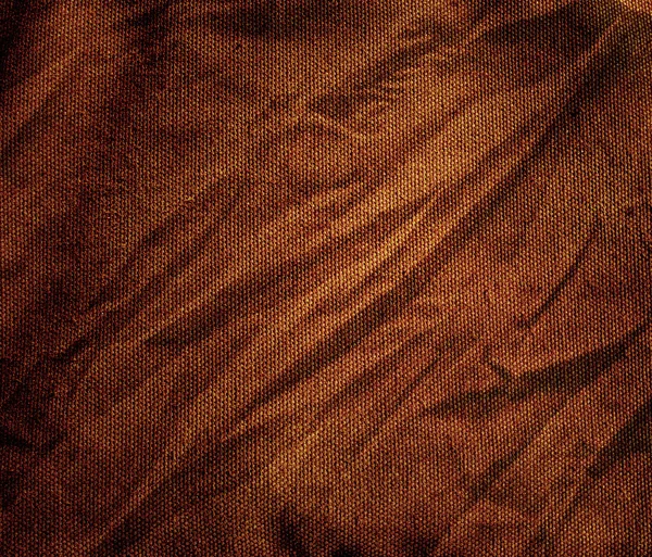 El fondo de tela arrugada de lona marrón — Foto de Stock