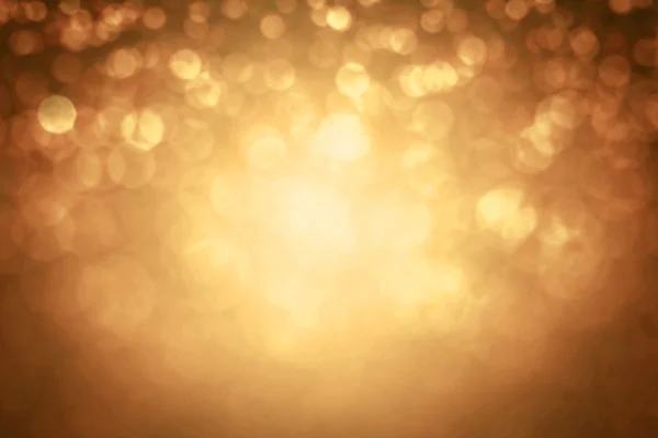 Absztrakt elmosódott a textúra csillogó arany bokeh világítás — Stock Fotó