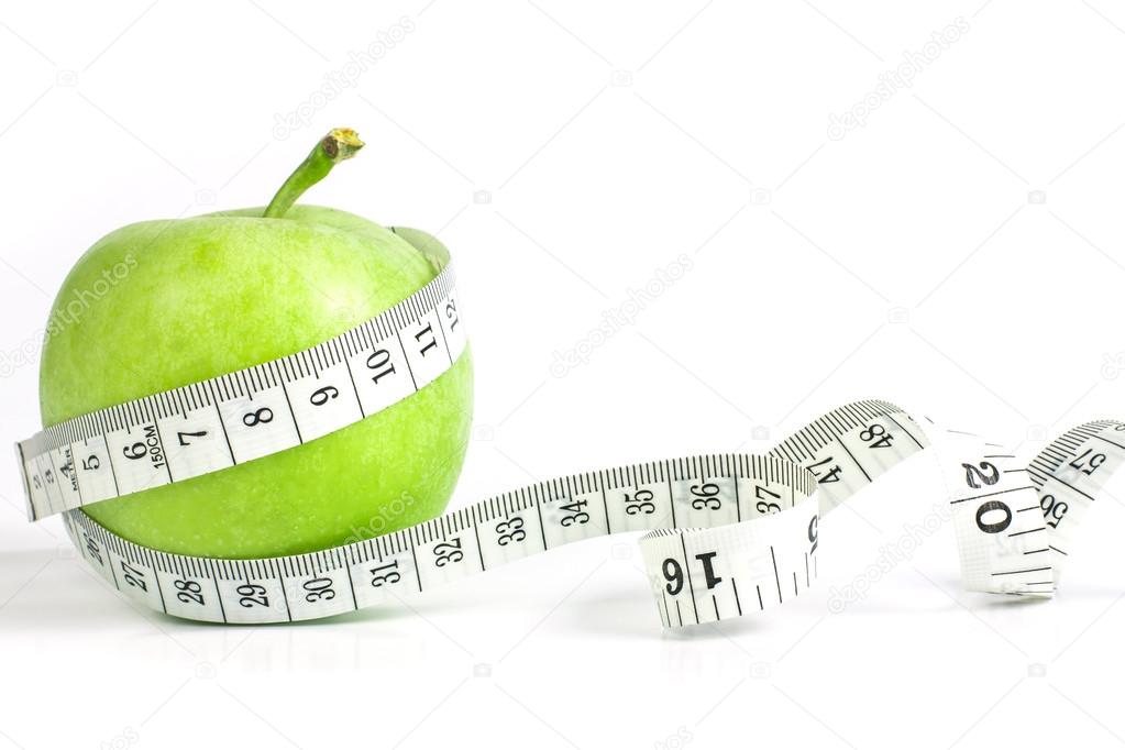green apple with Measuring tape on white background