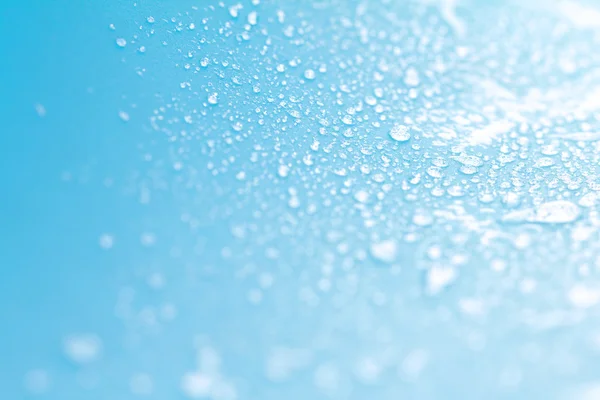 Close up rain water drops on blue sponge surface — Stock Photo, Image