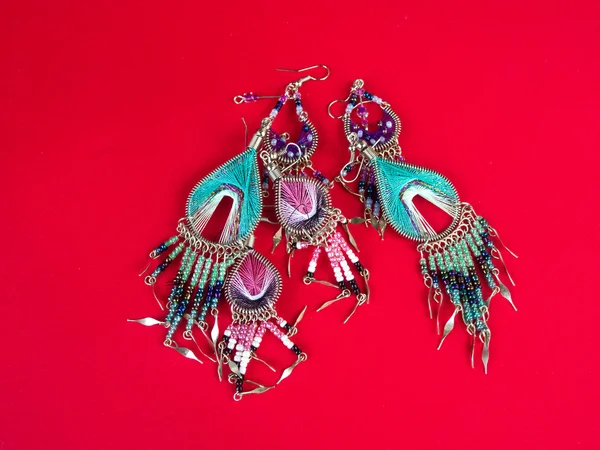 Earrings on Red Background — Stock Photo, Image