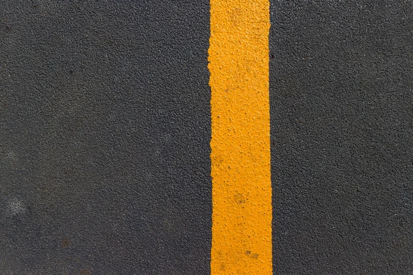 Asphalt texture with yellow  line — Stock Photo, Image