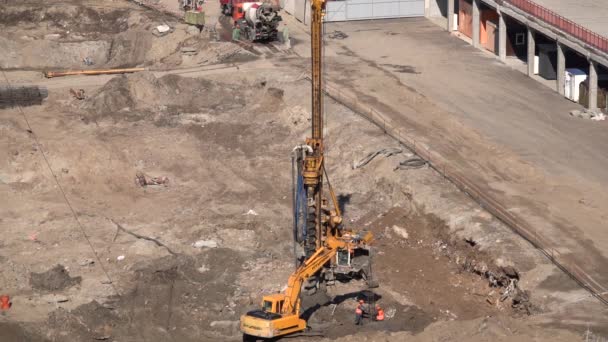 Drilling machine operation at the construction site of the house — Stock Footage Drilling Machine Operation Construction Site House Stock Video