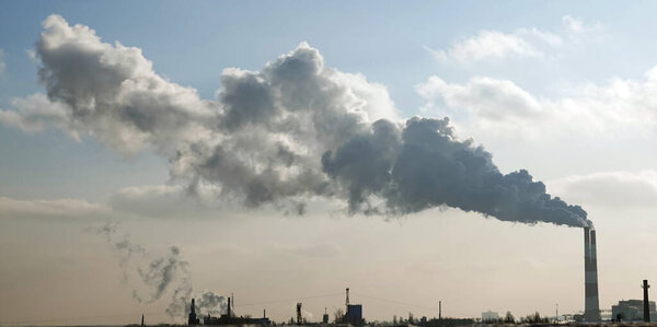 Kiev, Ukraine January 19, 2021: Chimneys smoke, polluting the air in the city worsening the environment