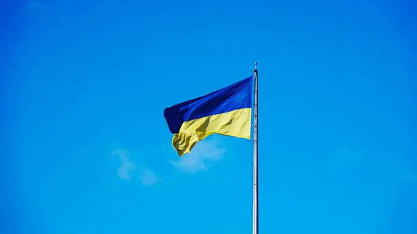 The flag of Ukraine is developing in a strong wind