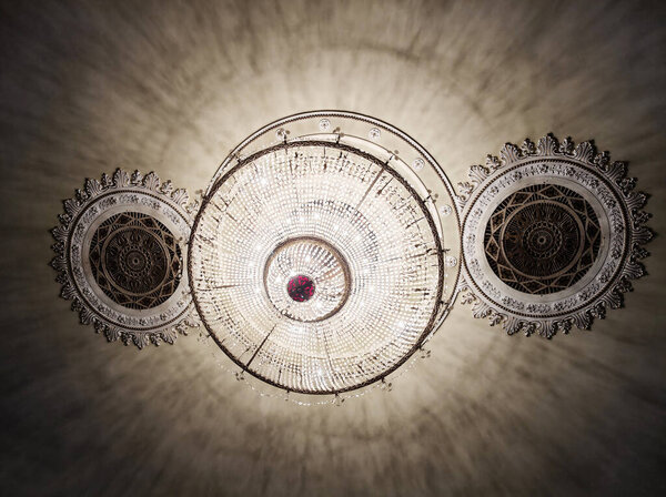 Kyiv, Ukraine, May 31, 2025: Antique crystal chandelier in the interior of an ancient building in Kyiv