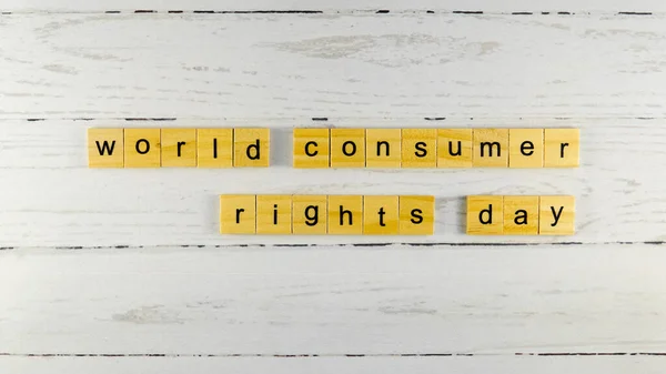 世界消费者权利日 来自木制立方体的文字 带有字母照片 免版税图库照片