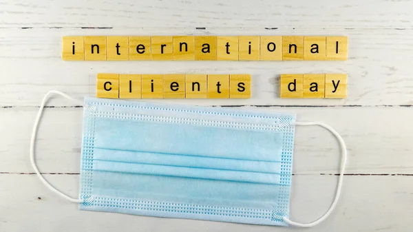 International Clients Day.words from wooden cubes with letters