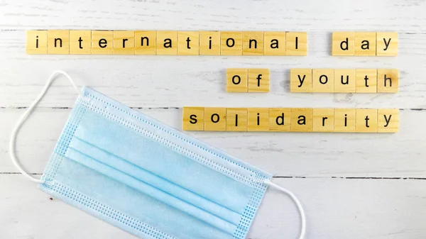 International Day of Youth Solidarity.words from wooden cubes with letters