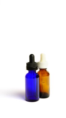 Brown glass bottles.A bottle with a pipette, isolated on a white background. glass container for cosmetic skin care products. Aromatherapy, essence, or perfume is empty. a bottle of cosmetic dropper. Amber apothecary flask with pipette. Beauty collag