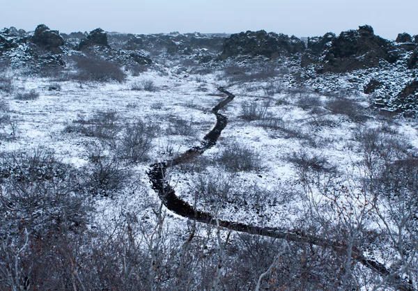 Black footpath and snow Stock Photo