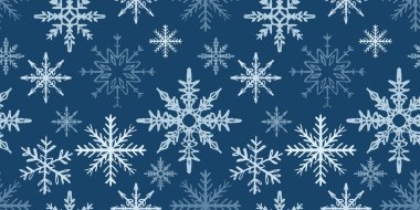 Hand drawn seamless pattern with blue snowflakes. Vector sketch illustration in vintage crayon textured style. Winter merry Christmas wrapping paper, winter background, textile