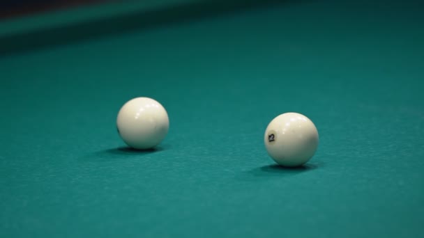 The cue ball after the collision with the object ball is heading back — Stock Video