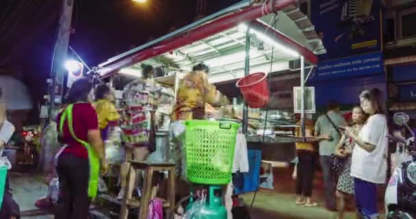Timelapse of street food noodle cart in busy operation to serve many customers, Nan, Thailand: October 2020 — Stock Video