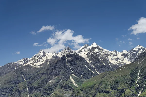 Snow peaks with clouds — Stock Photo, Image