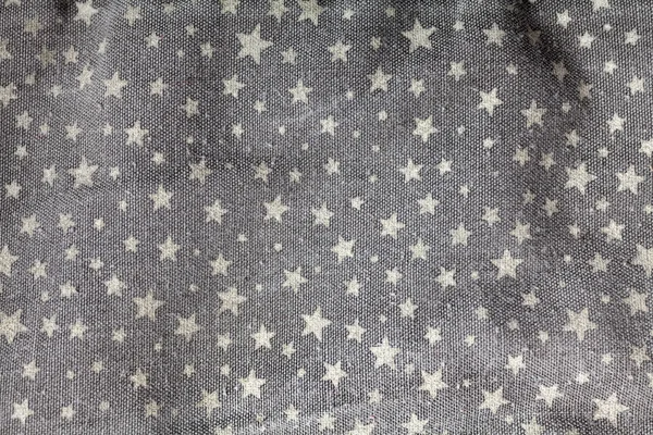 Stars on gray fabric — Stock Photo, Image