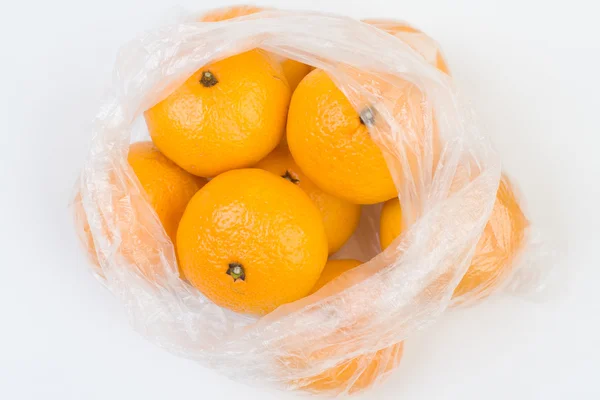 Mandarinas no saco de polietileno — Fotografia de Stock