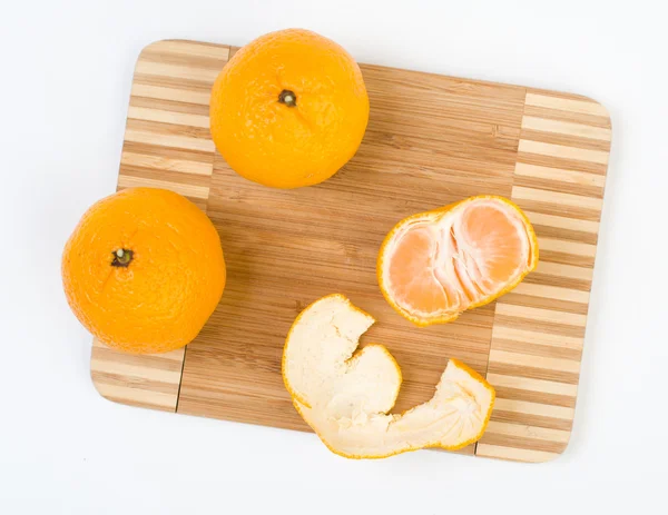 Mandarins on the kitchen cutting board — Stock Photo, Image