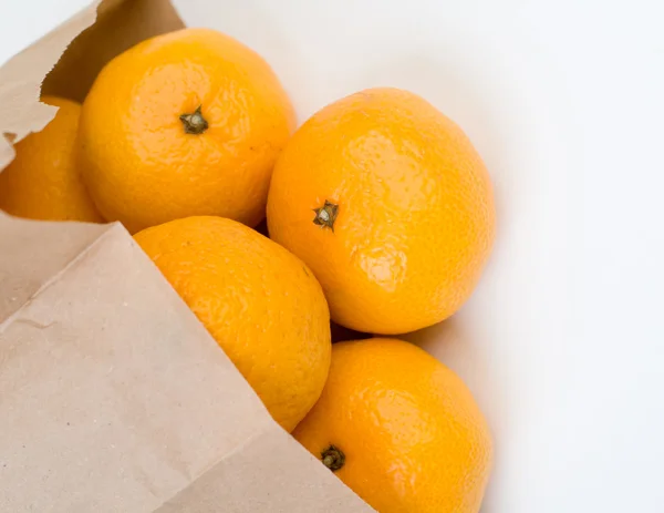 Mandarins out of  the paper bag — Stock Photo, Image