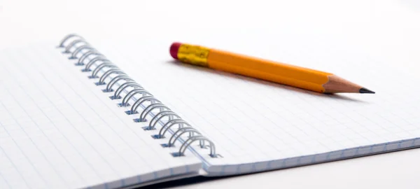 Pencil on the notepad composition — Stock Photo, Image