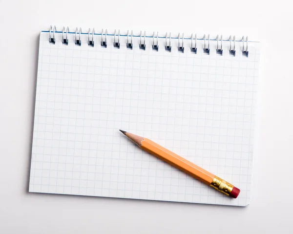 Pencil on the notepad composition Stock Image