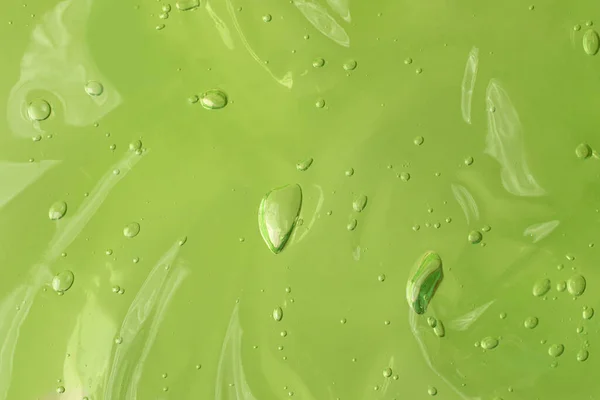 Suero Ondulado Con Gelatina Con Burbujas Fondo Verde Frotis Cosmética —  Fotos de Stock