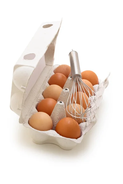 Whisk and eggs. — Stock Photo, Image
