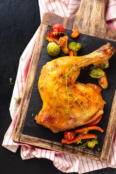 Chicken leg on slate. — Stock Photo, Image