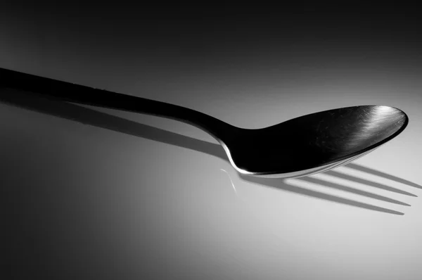 Spoon with a fork shadow — Stock Photo, Image