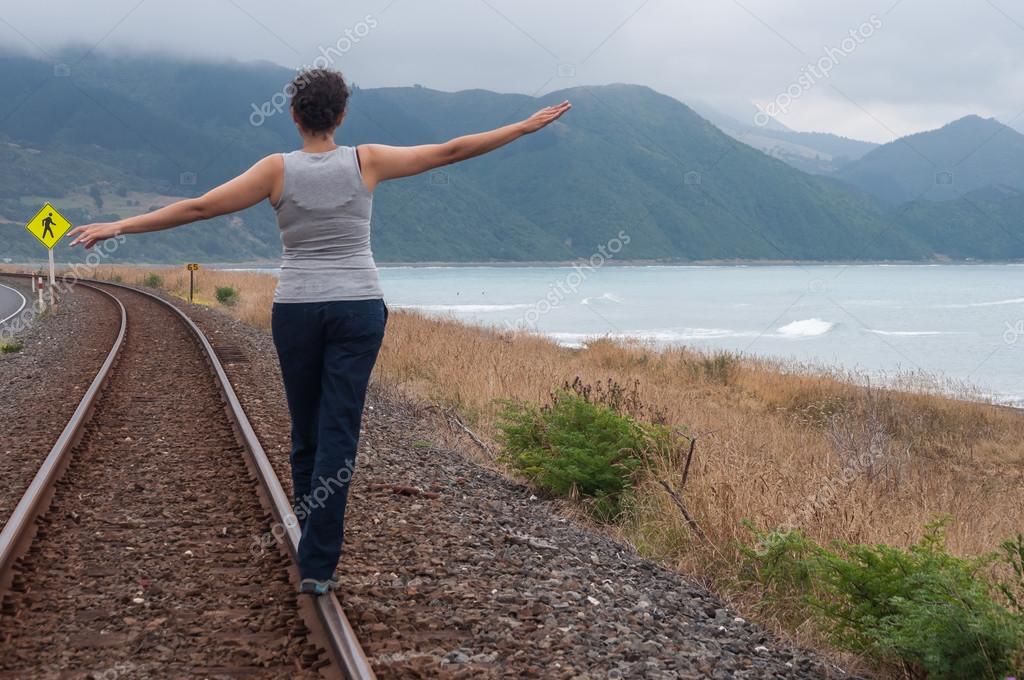 Walking on train tracks Stock Photo by ©kapy 66729975